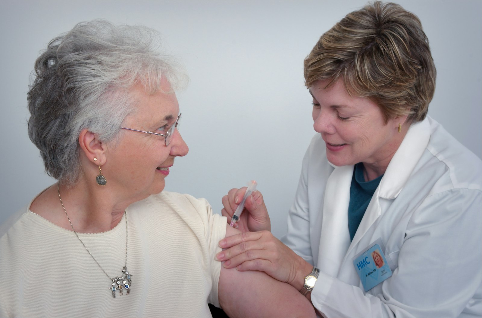 Nurse providing compassionate care for an older adult